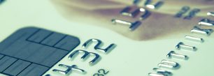 a close up of a credit card with a rose on it.